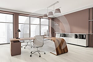 Head of company`s office interior with table and desktop computer, shelf with folders, white armchairs. Mockup copy space wall.