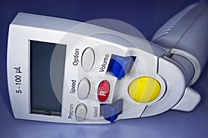 Head of electrnonic Micropipette 0.1 ml on a laboratory table. Labware