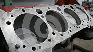 the head of an engine block is shown in a machine shop