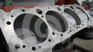 the head of an engine block is shown in a machine shop photo