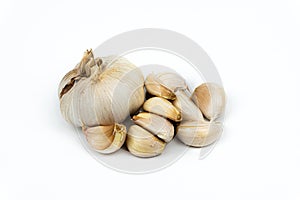 Head and garlic cloves isolated on white background