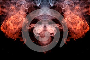 The head of a ghost on a black background from a smoke pattern of an orange-colored vape vaporizing