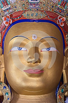 Head of a golden Buddha inside temple at Thikse monastery. Ladakh, India