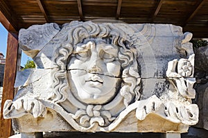 Ancient stone carving of Medusa Head. photo