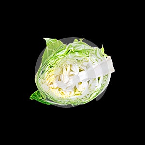 Head of green young cabbage vegetable isolated on a black background