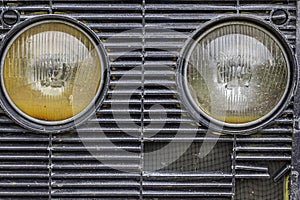 Head lamps on a farm vehicle grille
