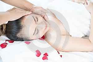 Head massage spa helps to relax. Asian woman receiving head massage in spa wellness center
