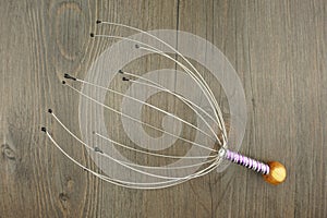 Head massage on wood background