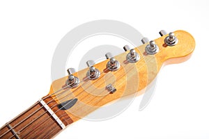 Head and neck of an electric guitar isolated on the white