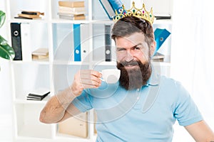 Head office concept. Man bearded manager businessman entrepreneur wear golden crown on head. Relaxed top manager