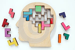 Head and pieces of a colored puzzle. Autism or neurodiversity concept.