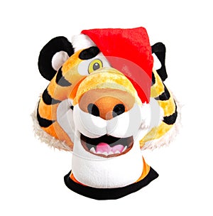 Head of a plush orange tiger in a red santa claus hat on a white background, isolate. Christmas and New Year 2022 concept, close-