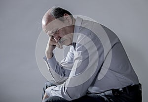 Head portrait of senior mature old man on his 60s looking sad and worried suffering pain and depression in sadness face expression