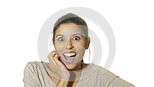 Head portrait of young crazy happy and excited hispanic woman 30s in surprise and astonish face expression with eyes wide open