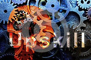 Head shape with assorted metal machine gears and Upskill text