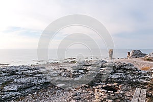 Head-shaped rock formation on the island of FÃÂ¥rÃÂ¶, Langhammars RaukomrÃÂ¥de, Sweden, Gotland, Europe photo