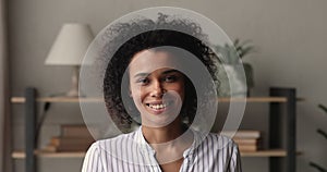 Head shot African businesswoman pose in office looking at camera