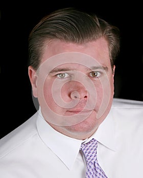 Head shot of a business man isolated on black