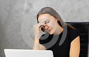 head shot caucasian businesswoman tired after working with computer, copy space at background. pretty caucasian woman relax