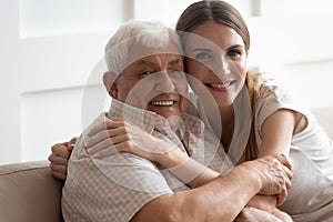 Head shot close up portrait happy two generations family cuddling.