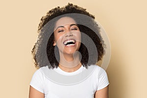 Head shot excited African American girl laughing out loud