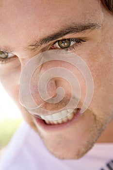 Head shot of man scowling photo