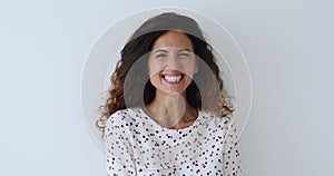 Head shot overjoyed millennial attractive woman laughing.