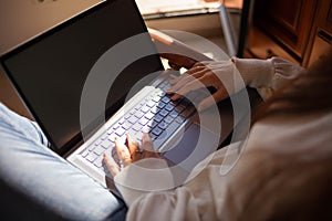 Head shot pleasant happy young woman freelancer working on computer at home. Attractive businesswoman studying online, using