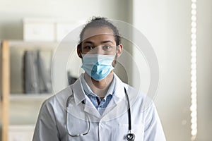 Head shot portrait African American man doctor wearing medical mask