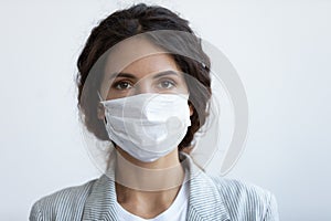 Headshot portrait woman wear face mask protecting from COVID19 photo