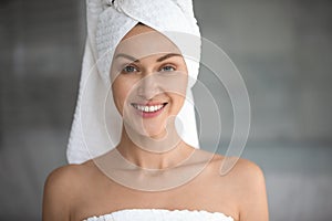 Head shot portrait beautiful woman with towel on head