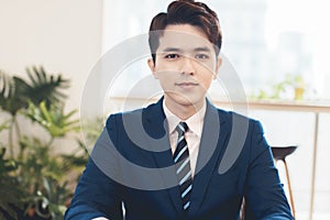 Head shot portrait confident young businessman  looking at camera and talking