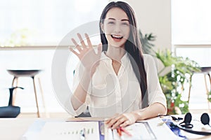 Head shot portrait confident young businesswoman  looking at camera and talking