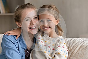 Head shot portrait of happy bonding multigenerational family.