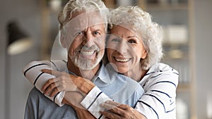 Head shot portrait of happy old retired family couple,