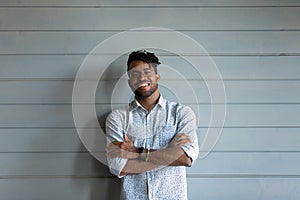 Head shot portrait smiling African American man on grey background