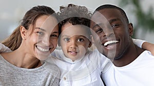 Head shot portrait smiling African American mother, father and son
