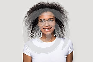 Head shot portrait smiling African American woman wearing glasses