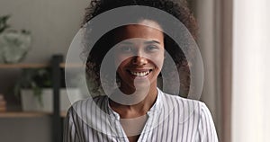 Head shot portrait smiling beautiful young african american woman.