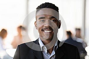 Head shot portrait smiling confident African American businessman in suit