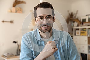 Head shot portrait smiling man wearing glasses making video call
