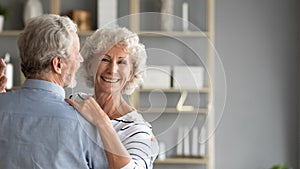 Head shot portrait smiling older woman dancing with man