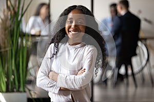 Head shot portrait of smiling young african american female professional.