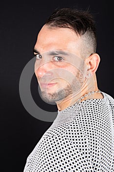 Head shot portrait young beard man under black background