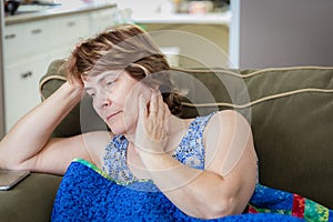 Head shot of a sad and depressed caucasian woman.