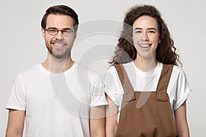 Head shot studio portrait smiling happy caucasian couple.