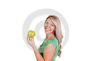 Head shot of woman holding an apple against white background