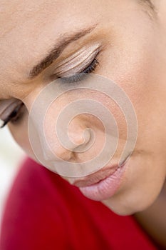 Head shot of woman scowling photo