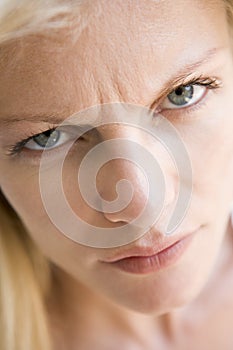 Head shot of woman scowling