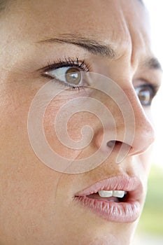 Head shot of woman scowling